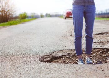 Potholes, Cracks & Curves: Who’s Liable When Bad Roads Cause Wrecks?